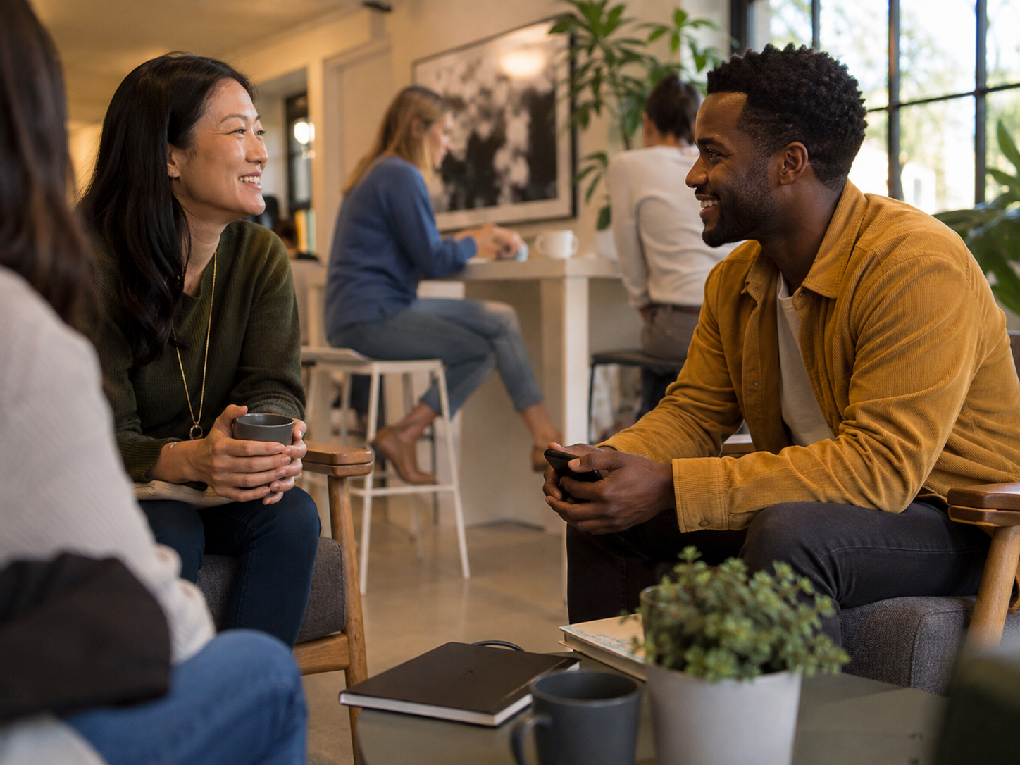 Adults meeting at a neighborhood coworking lounge.