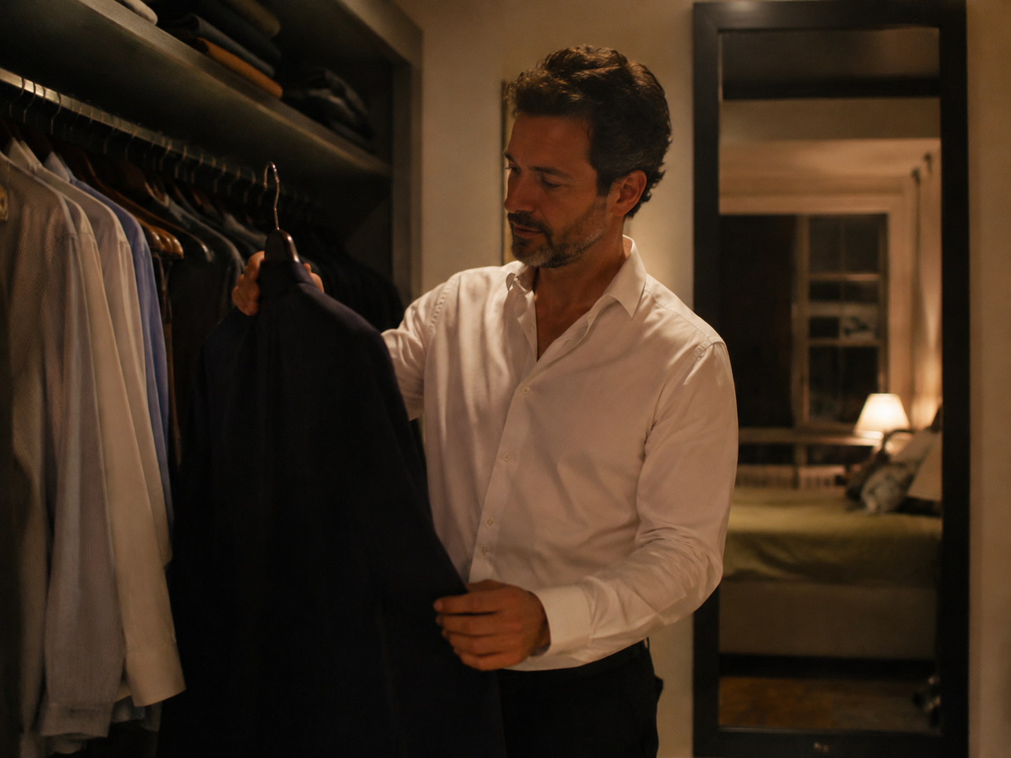 Adult selecting a jacket for an informal evening out