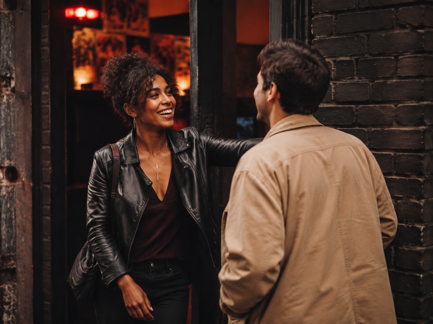 Adult greeting a companion outside a small music venue.